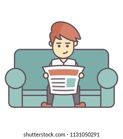 
A young man sitting on sofa and reading the morning paper 
