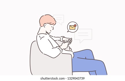 The young man is sitting on the sofa checking the message on his cell phone.Hand drawn style vector design illustrations.