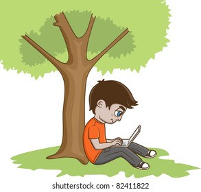 Young Man Sitting under the tree and using laptop