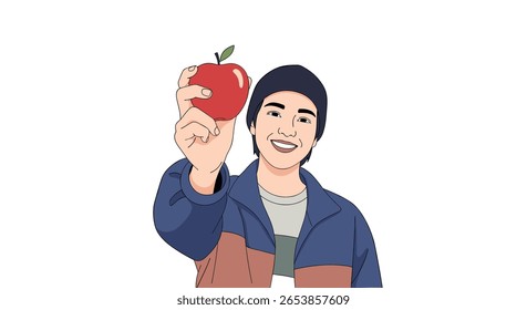 A young man smiles and holds up a shiny red apple to the camera wearing a blue jacket and a beanie