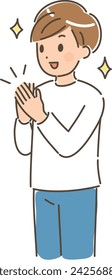 Young man smiling and clapping.He is wearing a long sleeve clothes.
