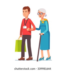 Young man social worker helping elder grey haired woman with grocery shopping. Strolling with old lady. Flat style vector illustration isolated on white background.