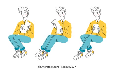 The young man sorts through important papers. The guy reads the documents. Sitting man.