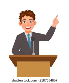 Young Man Speaker Giving Speech Standing At Podium In A Conference Meeting Hall