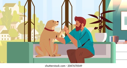 young man spending time with dog male owner and cute domestic animal friendship with pet concept