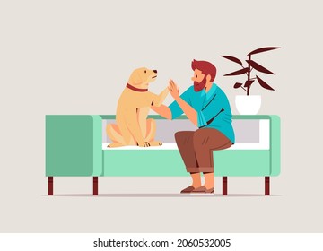 young man spending time with dog male owner and cute domestic animal friendship with pet concept