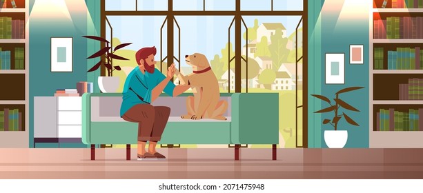 un joven pasa tiempo con un dueño de perro y una linda amistad animal doméstica con un concepto de mascota