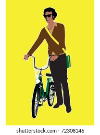 Young man standing with a bicycle