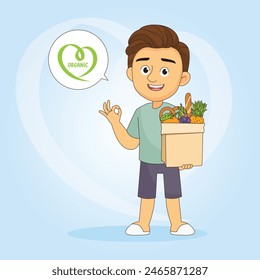 Young man standing and holding basket with fresh raw organic vegetables and fruits in hands