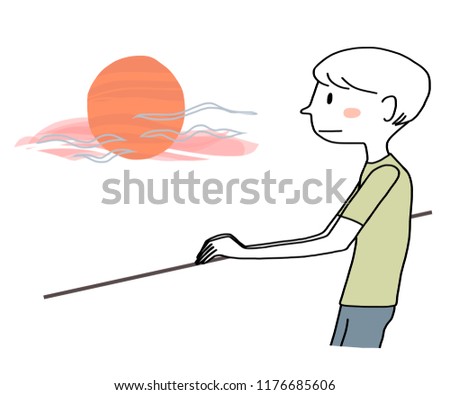 Young man standing on balcony and watching sunset or sunrise thoughtfully. Pensive man looking out and watching twilight sky until dusk.