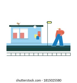 Young man standing on platform and waiting for coming train