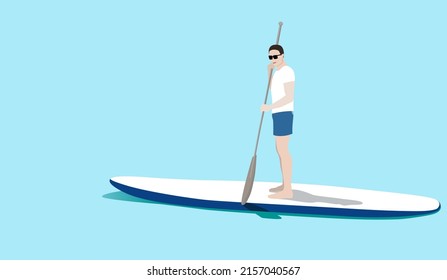 Young man standing on sup board floating in sea in sunny day. Tourist learning to paddle and balance on paddle board.