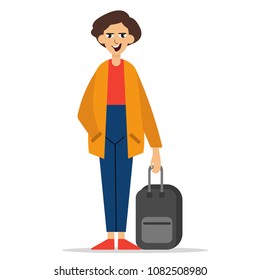 Young man standing with suitcase