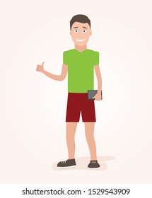 A young man stands with a tablet in his hand