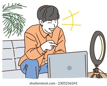 Young man streaming video on a laptop
