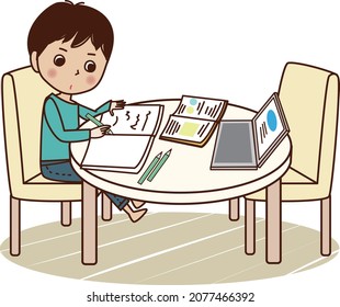 Young man studying at table.
