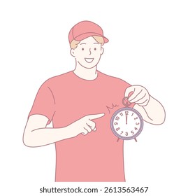 A young man in a stylish cap points at a vintage clock, showcasing impressive time management skills