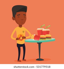 Young man suffering from heartburn. An african-american sad man having stomach ache from heartburn. Upset man having stomach ache after fast food. Vector flat design illustration. Square layout.