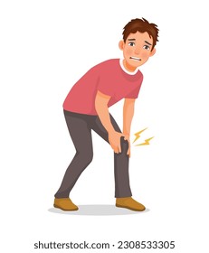 Young man suffering from knee pain holding his injured leg