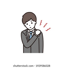 A young man in a suit suffering from stiff shoulders