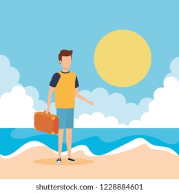 young man with suitcase on the beach