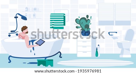 Young man taking bubble bath using laptop
