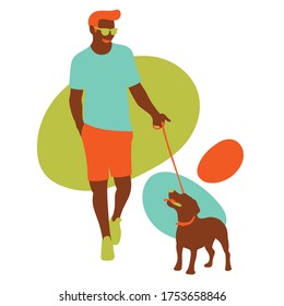 Young man took the dog for a walk happily