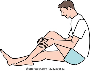 Young man touching his shin