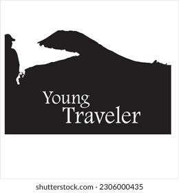 Young man traveller or explorer standing on top of mountain or cliff and looking on valley. Concept of discovery, exploration, hiking, adventure tourism and travel. 