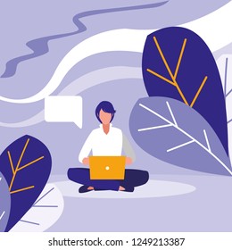 young man using laptop in the landscape