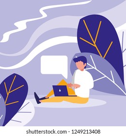 young man using laptop in the landscape