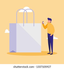 young man using smartphone with shopping bag