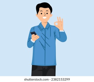 young man using smartphone and showing ok gesture