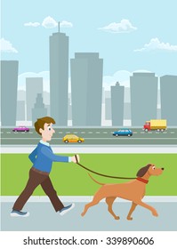 young man walking with a dog in city