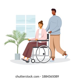 Young man walking with his girlfriend sitting on wheelchair