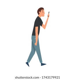 Young Man Walking Outside, Guy Looking at His Smartphone, Person Using Digital Gadget for Online Communication Vector Illustration