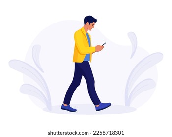 Young man walking using his smartphone and texting. Businessman is going with mobile phone in hand and writing message. Social media, blogging. Corporate worker doing business online