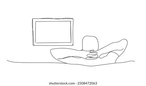 Young man watching television at home on the couch. One continuous drawing line logo single hand drawn art doodle isolated minimal illustration. Television box for news and show translation