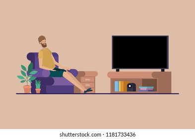 young man watching tv on the livingroom