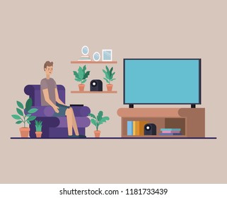 young man watching tv on the livingroom