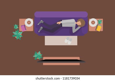 young man watching tv on the livingroom