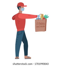 Young man wearing a medical mask and medical gloves to prevent the spread of the corona virus. Person going from the supermarket and holding grocery products in a bag. courier holds out a grocery bag.