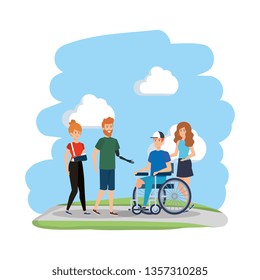 young man in wheelchair with friends in the park