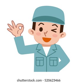 Young man in work clothes is issuing an OK sign