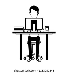 Young man working with computer in black and white
