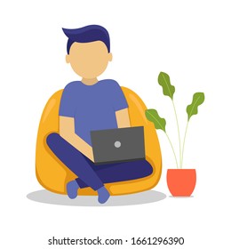 Young man working with his laptop. sitting relaxed on a bean bag. Vector illustrator