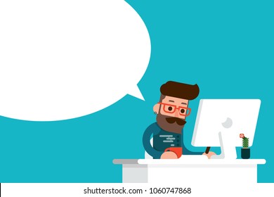 young man working on computer with speech bubble.