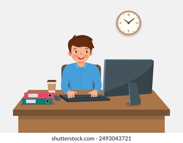 Young man working on computer at the desk in the office