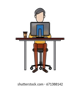 young man working on computer at office desk