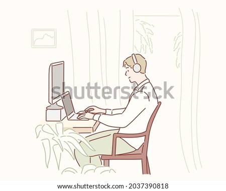 Young man working on laptop at home. Hand drawn style vector design illustrations.